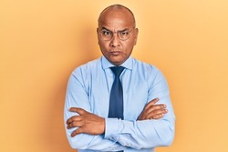 Middle age latin man wearing business clothes with arms crossed gesture skeptic and nervous, frowning upset because of problem. negative person. 