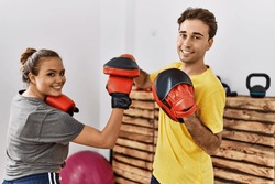 Man and woman couple smiling confident boxing at sport center