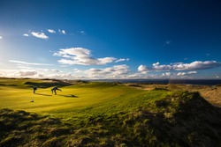Golfers on a lovely golf course in St. Andrews, Scotland