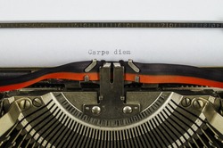 Carpe diem word printed on an old typewriter