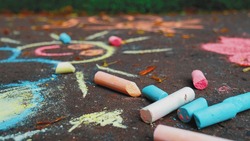Simple Chalk Drawings Art on Sidewalk Pavement in Public City Park Made By Creative Kids