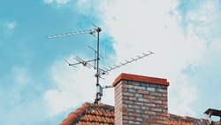 Aerial TV Antenna Installed on Building Rooftop