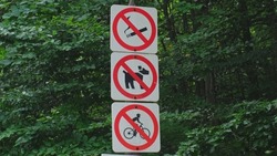 Prohibition Signs at Entrance to National Park Forest No Smoking No Animals No Biking No Dogs