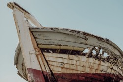 Detail of a derelict boat wreck in vintage style