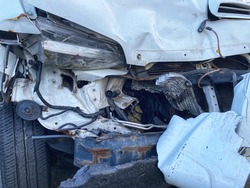 Van front damaged due to accident - Automotive insurance coverage, repair, garage concept