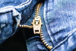 Blue Jean with gold zipper. selected focus. background and textures.  