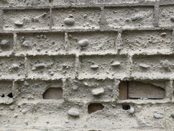eroded brick wall texture. less cement brick texture
