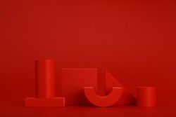 Abstract monochromatic still life in red colors with different geometric figures on red background with space for text