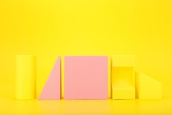 Abstract trendy futuristic background in yellow and pink colors with copy space. Bright artsy background with geometric shapes against yellow background with copy space