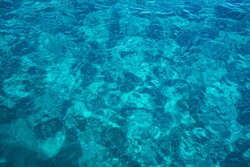 Still calm sea or ocean blue water surface background