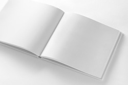 Mockup of opened blank square book at white design paper background.