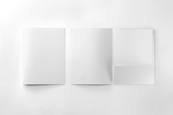 Corporate stationery set mockup. Two presentation folders and letterhead at white textured paper background. 