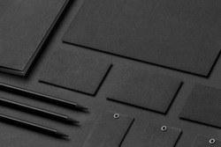 Brand identity mockup. Blank corporate stationery set at black textured paper background.