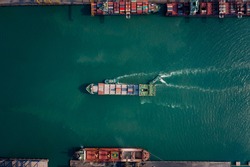 Aerial top view of containers ship floating in sea at shipping port for international import  export cargo logistics transportation business services and industry 