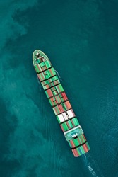 container ship carrying container box global business delivery service cargo by freight shipping commercial trade logistic and transportation over sea worldwide aerial top view photograph from drone 