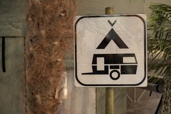 Sign with camping and caravan logo