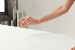 hand on the table with finger and object