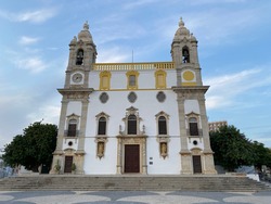 Historic portuguese Igreja do Carmo church in Faro at Algarve in Portugal, Europe, famous for chapel Capela Dos Ossos and old wall grave and tombs with spooky bones and skulls of dead carmelite monks.