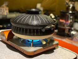Hot pot dish on a cassette stove in the tent