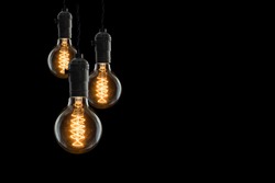 Idea concept -  incandescent bulb on black background