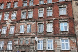Old disgraced tenement houses in Wrocław, ruins made of red brick