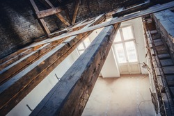 empty attic / loft during dry rot renovation, old roof beams