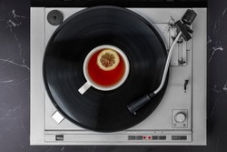 Turntable Vinyl records, party music, top view. Cup of tea. Vintage retro sound recording style. Background for the design of a poster, postcard, flyer for music events.
