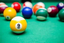 9 Ball from pool or billiards on a billiard table