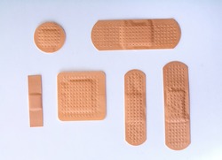collection of six different bandages on white background