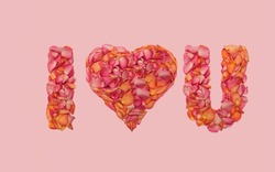 I love you sign inspired concept. Beautiful short text made of roses petals. Flat lay arrangement against gentle pink background