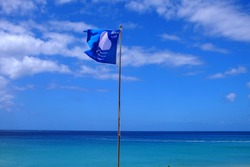 A blue flag on the beach in Morro Jable in Fuerteventura.