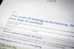 Paper electricity bill with cost increasing notice in England UK
