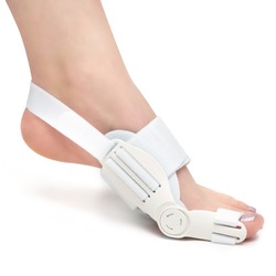 orthosis for bunions, hallux valgus on the woman's foot. Chiropractic solution with orthose, medical footwear for problem with deformed toe
