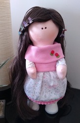 Cloth doll with long hair and pink dress