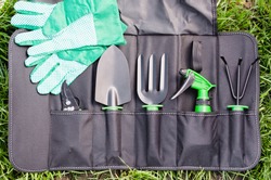 Gardening Tools in the Bag on the Grass. Concept Gardening and Agriculture. Selective Focus.