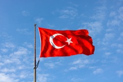 Turkish Flag on cloudy sky background. 19 mayis, 23 nisan, 15 temmuz, 30 agustos, 29 ekim, 10 kasim. Turkish nation. 19 may, 23 april, 15 july, 30 august, 29 october.