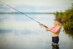 blonde girl fishing, selective focus
