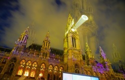 Gothic effect, double image and zoom blur effect creating erie impressionist image of town hall or Rathaus in Vienna., Austria.