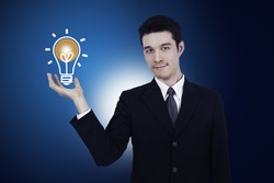business man holding light bulb ,thinking of new idea