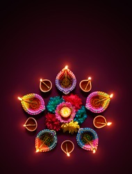 Colorful diya lamps lit during diwali celebration