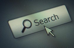 Close-up of a interface computer search button and an arrow mouse cursor
