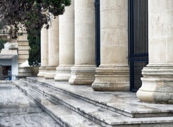 Detail of a court house. Roman columns architecture in Valletta, Malta