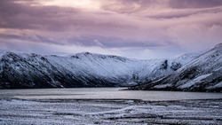 A scenic views for the stunning Loch Muick in winter time in the Scottish Highlands, the use of wide as well as high resolution leneses reflects brilliant colours such as grey, orange, purple, and blu