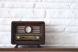 nostalgic vintage radio on wooden wall shelf