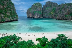Aerial view of Maya bay. Maya Bay is the crown jewel of Phi Phi Islands in southern Thailand. It is situated in the Hat Noppharat Thara – Mu Ko Phi Phi National Park in Thailand.