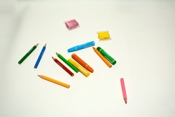 un arranged crayons, color pencils, and embroidery thread. creativity idea, drawing, hand made. 