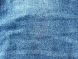 Old dark blue jeans seamless and patterned, denim texture background.