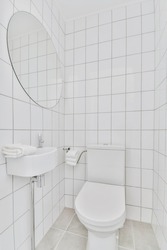 Interior of an attractive restroom with small sink