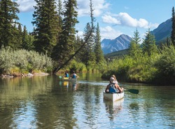 Canoeing in a Canadian river. paddling in the water. hobby, outdoor activities