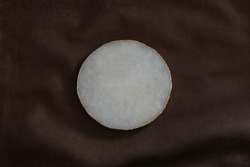 Mockup for text or logo. Free space, copy space. White, round, marble form on vintage leather texture.